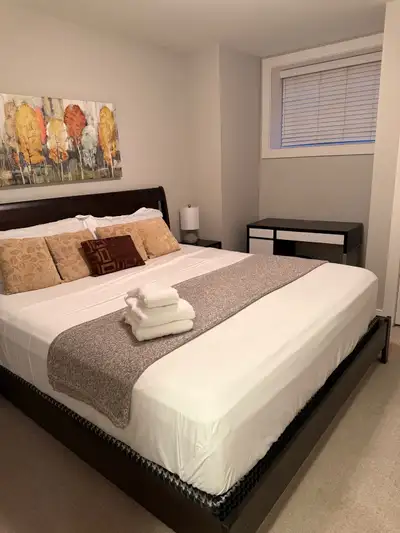 This stunning, fully furnished 2-bedroom half basement apartment offers 1000 square feet of comforta...