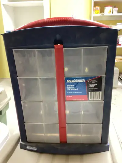 Mastercraft ‘Drop Bin’ storage . 12 1/2 “ wide x 4” deep x 17” tall. Can hang on a wall or sit on wo...