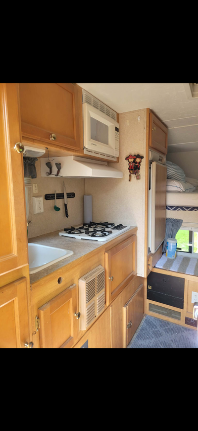 2006 slide camper fits 1/2 ton truck 8 ft box or shorter only weights 1440 lbs everything works good...