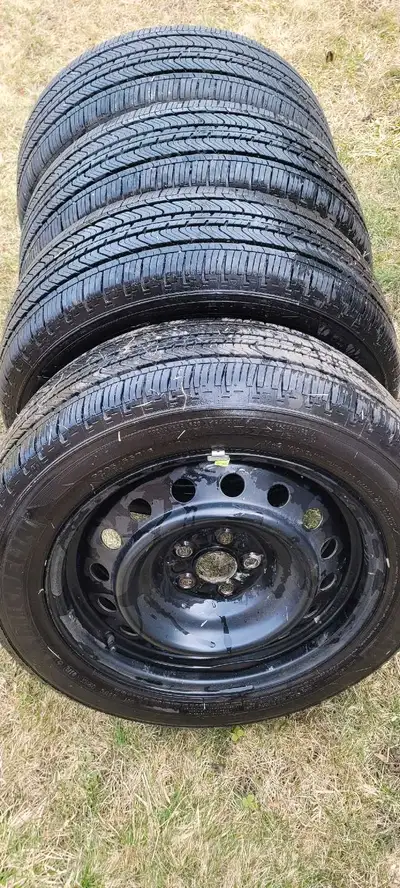 A set of 4 Michelin primacy all season Tires mounted on steel Rims with 90 percent tread remaining ....
