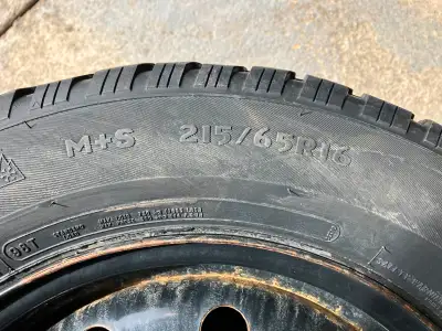 Four studded Artic Claw winter tires. 3/32 to 7/32 tread left. Rims fit a 22+ Equinox or 21+ Trailbl...