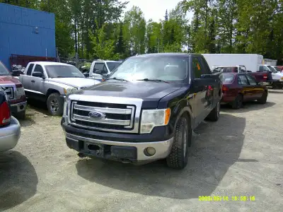 2 ford f150 pickup truck being parted out, black one is a 2013 and blue is a 2011. Both are being pa...