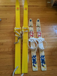Vintage kids cross country skis for decor, yellow ones left