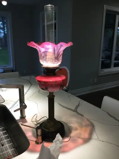 A stunning tall pale cranberry antique Victorian deluxe lamp. Dated to 1837-1901, oil lmap and has b...