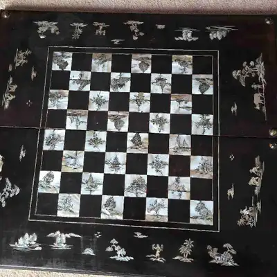 Chess and backgammon set with mother of pearl inlay work. Chess and Backgammon pieces included and a...