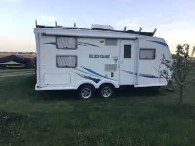 19’ Solar Powered and or Plug in Fully Loaded Holiday Trailer. Galvanized Frame, Canvas Skirting, Ya...