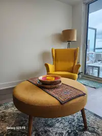 Pretty yellow armchair with cofee table
