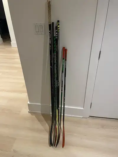 Multiple hockey sticks for sale. All used condition, but structurally strong with no cracks 1) Sherw...