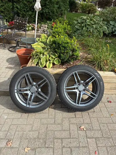 4 2025 lightly used Pirelli Ice Asimmetrico 245 45R18 Winter tires mounted on pictured wheels.