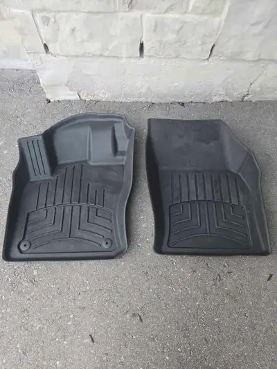 These are used WeatherTech floor mats designed specifically for a Volkswagen Tiguan, offering superi...