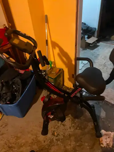 Never been used exercise bike. Folds in and out