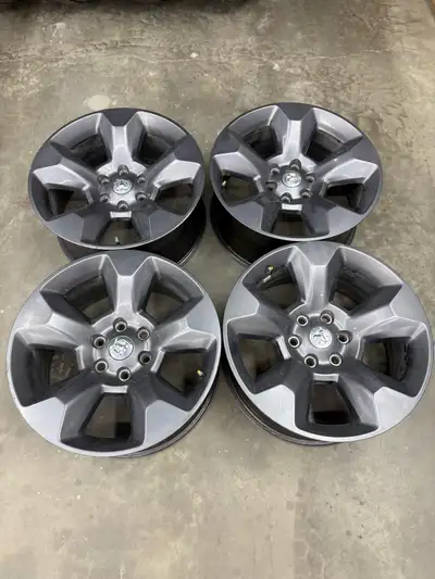 Full set of four ram 1500 rims 6 bolt new body style 20” 6x5.5” or 6x139.7 Polish grey finish Great...