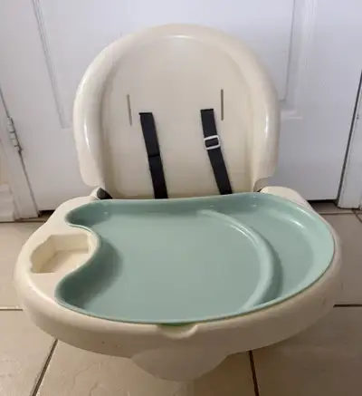 Ingenuity Baby Base 2-in-1 versatile booster seat designed to assist babies in sitting up right, tra...