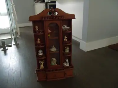 Wooden wall portable display cabinet with glass shelves where you can store your small treasured col...