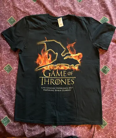 Selling the Game of Thrones Live Concert Experience T-Shirt. This T-Shirt was sold at the Live Conce...