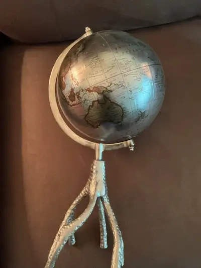 This pre-owned decorative tabletop globe features a unique metallic finish and an artistic tripod st...