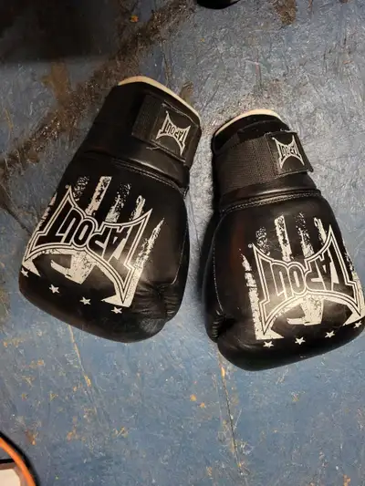 I'm selling a pair of used Tapout boxing gloves, great for sparring or bag work. They are black with...
