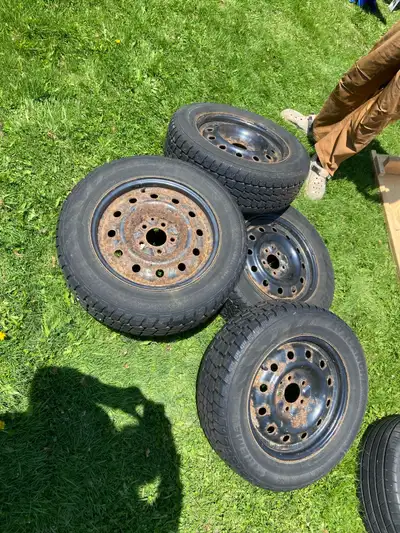 Set of 2 winter tires and rims off Impala. Good to use for a few more years. $40, tire size in pics....