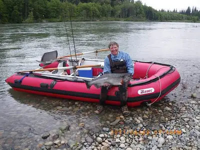 a 14 ft inflateble with oars, aluminum floor, aluminum rowing frame, anchor etc,