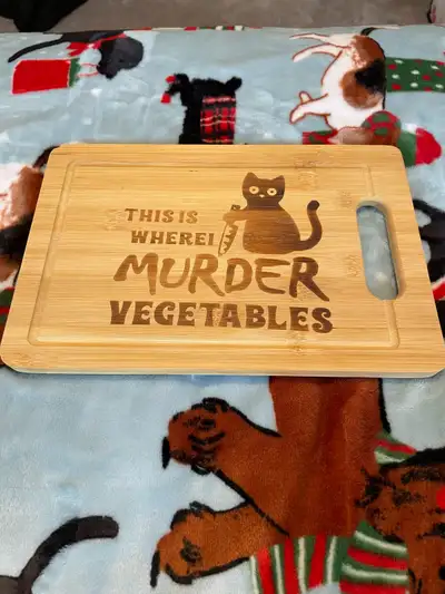 I'm selling a used cutting board with a unique cat design, perfect for any cat lover's kitchen. This...