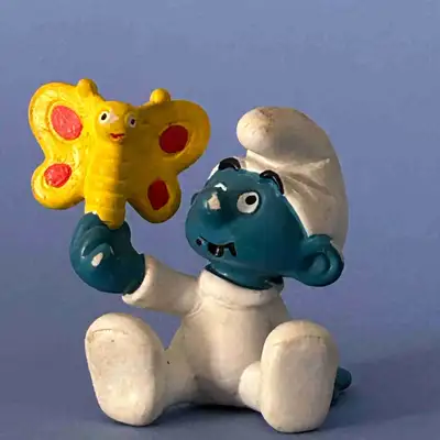 Baby Smurf with yellow butterfly vintage Smurfs Figurines , View more