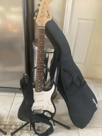 In barely used condition with strap and gig bag