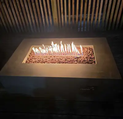 This Real Flame Aegean rectangle fire pit offers both propane and natural gas options, making it a v...