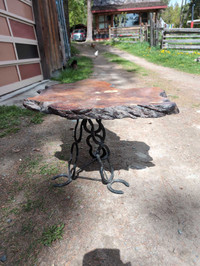 Burl Table with horse shoe legs.