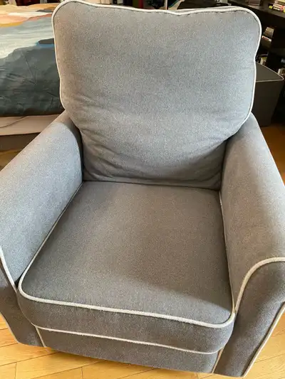 This is a comfy chair and footstool purchased from Bed Bath and Beyond with nursing a child in mind...