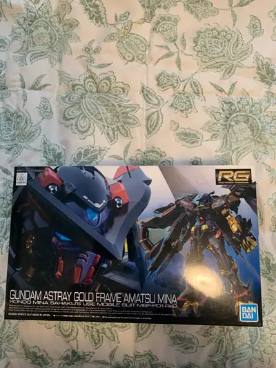 This is the Real Grade (RG) 1/144 scale Gundam Astray Gold Frame Amatsu Mina model kit. It includes...