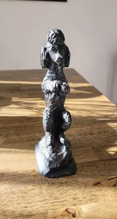 Hand carved wooden poodle statue. Beautifully done with nice attention to detail. If interested, tex...
