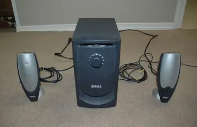 Set consists of two desk top speakers connected to a subwoofer speaker unit. The subwoofer needs it'...