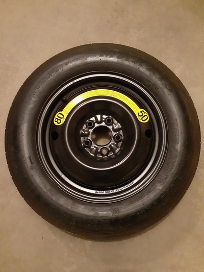 Emergency "donut" spare tire from 2006 Hyundai Tucson. This OEM 27 inch diameter T155/90D16 tire wil...