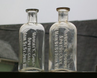 Two Robert E. Coupe bottles Saint John