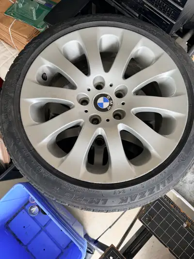I'm selling a single BMW 17-inch rim with a Bridgestone Blizzak LM-25 tire, size 225/45 R17 94V. Ple...
