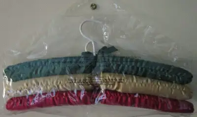 If ad is up the 2 sets are available 2 sets of padded clothes hangers Never used, still in original...