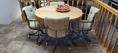 Round Kitchen Table with 5 Chairs and an extra table leaf., View more