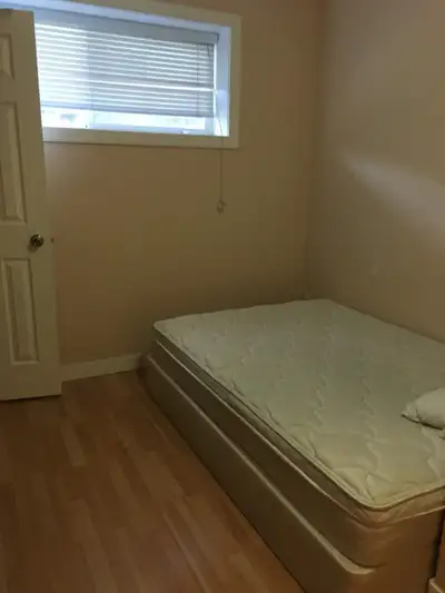 Basement room close to SAIT $550/m utilities included , 3 bedrooms shared kitchen living and bathroo...
