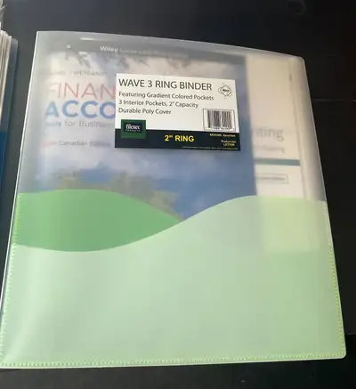 Used Intro to Financial Accounting textbook, eighth edition. In a three-ring binder with page coveri...