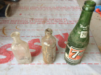 antique bottles (seven-up, tuttles elixer)