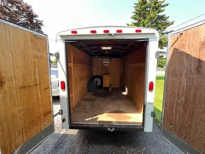 6x10 Enclosed Cargo Trailer – Upgraded Axle, Inverter, Awning & More! Ready to tow and fully loaded!...