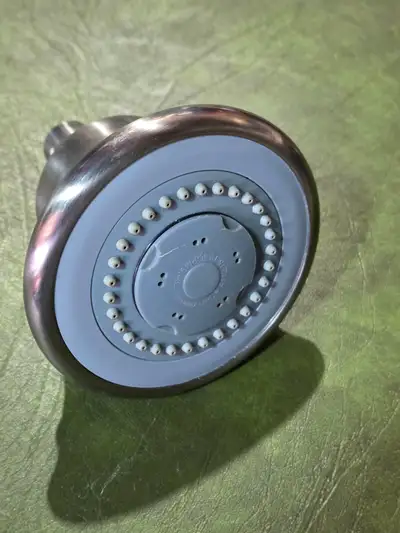 Basic brushed nickel showerhead with standard threading. Works perfectly, just swapped it out for a...