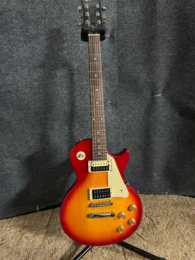 The Epiphone Les Paul 100 is designed as a beginner instrument within the Les Paul family of guitars...