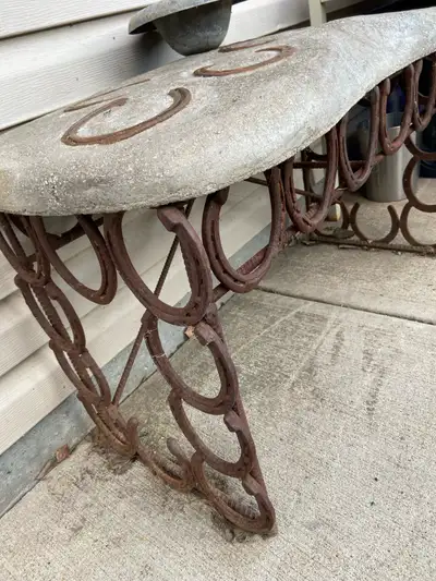 This unique concrete and metal bench is a one-of-a-kind piece, perfect for adding a rustic touch to...