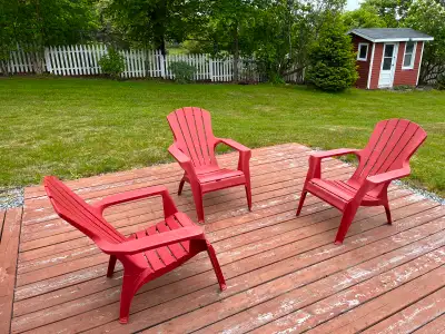 Red plastic Adirondack chairs, View more