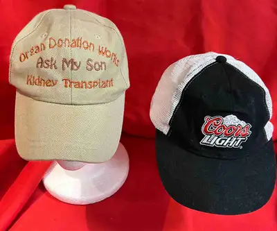 Here are two used hats. The tan hat has "Organ Donation Works Ask My Son Kidney Transplant" embroide...