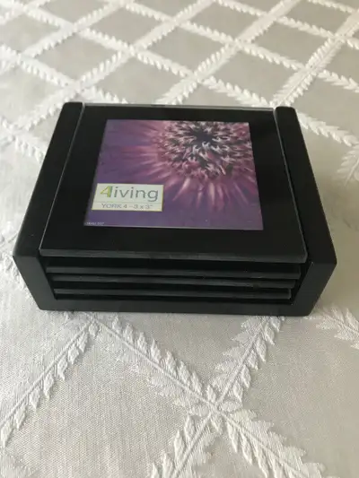 Coasters - Set of 4 - $5.00 -Brand New! -in original packaging -black finish -size: 5” x 3” each -ea...