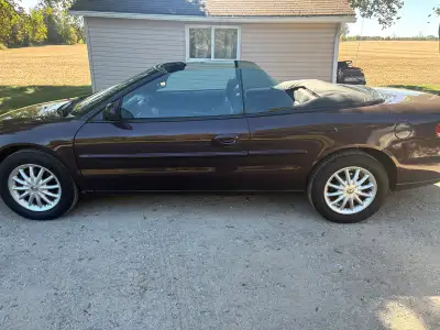 This Chrysler Sebring is a well-maintained, pre-owned convertible featuring a smooth automatic trans...