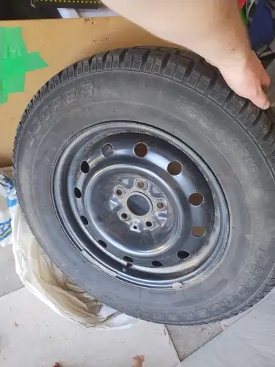 Selling a set of 4 Cooper Discoverer M+S winter tires on black steel rims. Tire Size: 235/70R16 Bolt...