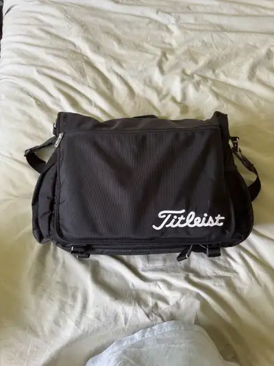 This is a black Titleist laptop bag, perfect for carrying your essentials on and off the golf course...